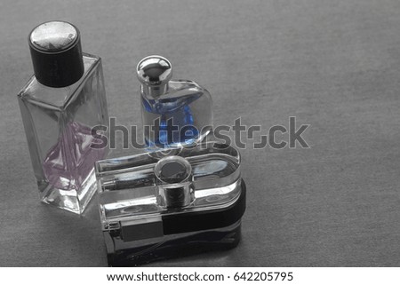 Men's quality cologne smells in assortment of bottles.  Copyspace.