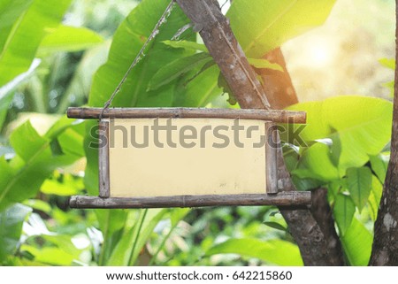 Wooden sign in the natural garden.