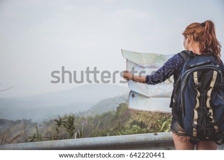 woman  travel. Female travelers travel nature mountain map navigation