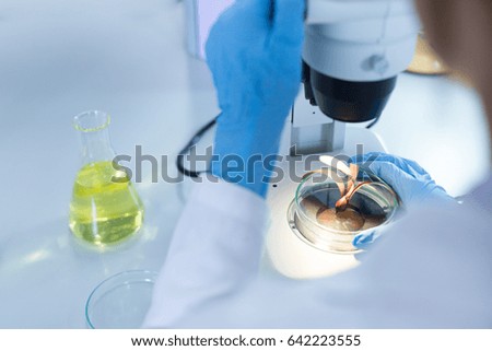 Scientist researching chemistry, technology and biology in laboratory.