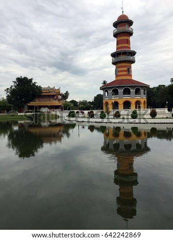 The View and reflected picture on the water
of Witthunthassana Hall in Bang Pa-In Palace Ayutthaya Thailand.