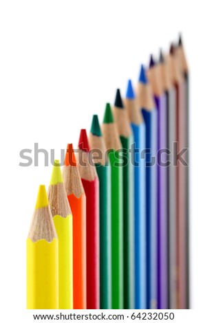 Colored pencils isolated on white background. Shallow depth of field. Studio work.