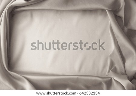 Texture background of fabric. White fabric. Silk fabric wallpaper texture background in sepia pastel white shade Lovely natural silk textured textile. White abstract fabric background with soft waves.