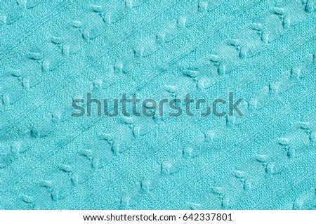 Texture, background, pattern. Women's woolen blue striped sweater