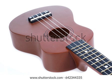 Brown ukulele - isolated white background