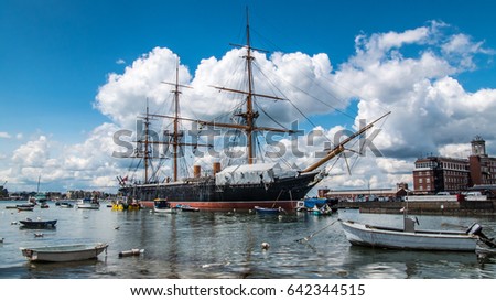 View of an historic Victorian armoured frigate battleship in Portsmouth harbour Royalty-Free Stock Photo #642344515