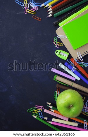 School supplies on dark table