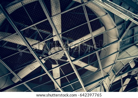Huge industrial cooling fan, big cooler. Greenery color. Royalty-Free Stock Photo #642397765
