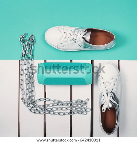 Flat Lay of Modern White Shoes. Overhead Top View Photography. Youth Lifestyle Concept. Turquoise background
