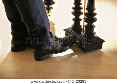 Man feet while playing piano