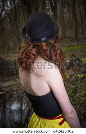 Portrait of a hippie young woman wearing a hat