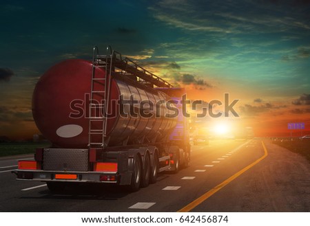 tanker on the big highway, at sunset on the road Working visit . Royalty-Free Stock Photo #642456874