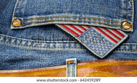 American flag in a pocket of blue old jeans. Happy independence day