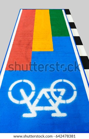 White bicycle icon on blue bicycle lane on gray background