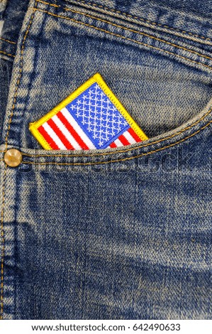 American flag in a pocket of blue old jeans. Happy independence day