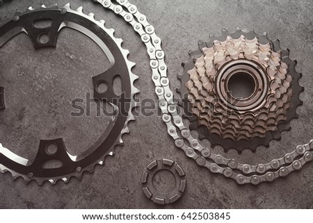 Bicycle parts on gray background
