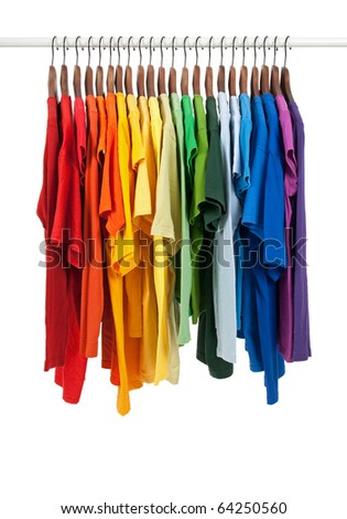 Colors of rainbow. Variety of casual shirts on wooden hangers, isolated on white. Royalty-Free Stock Photo #64250560