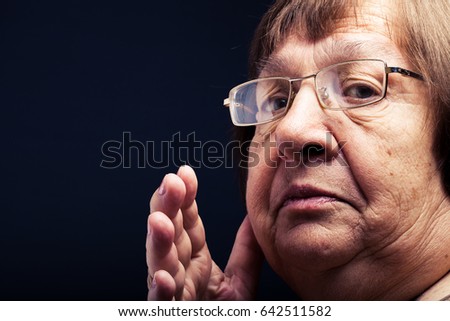Portrait of elderly woman. Secret. Toned.