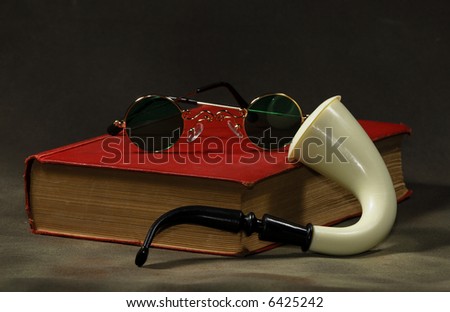 Photo of a Book with a Pipe and Glasses