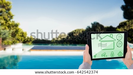 Digital composite of Cropped image of person using smart home app on tablet PC at poolside