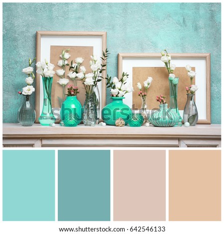 Mint color matching and flowers in vases on mantelpiece