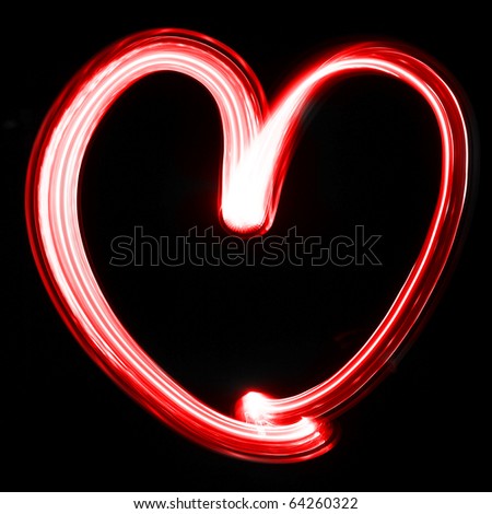 a red heart drawn on a black background