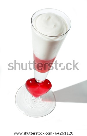Picture of beautiful goblet with symbol of red heart with sweet dessert
