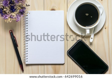 Flat lay desk with coffee, notebook, smartphone and flowers Royalty-Free Stock Photo #642699016