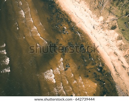drone image. aerial view of baltic beach coast in sunny spring day. latvia - vintage effect