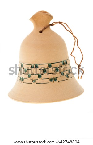   close-up photo of a bell isolated from a white background made of clay