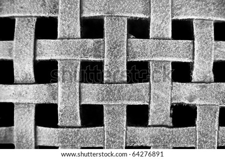 Woven Metal Mesh Grid Pattern on a black background