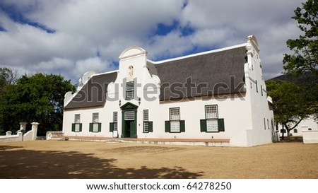 The manor house at Groot Constantia, the oldest and most historic of South Africa's wine farms. Royalty-Free Stock Photo #64278250