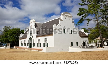 The manor house at Groot Constantia, the oldest and most historic of South Africa's wine farms. Royalty-Free Stock Photo #64278256