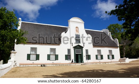 The manor house at Groot Constantia, the oldest and most historic of South Africa's wine farms. Royalty-Free Stock Photo #64280167