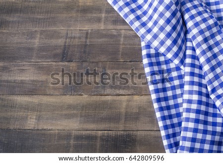 Checkered napkin on wooden background