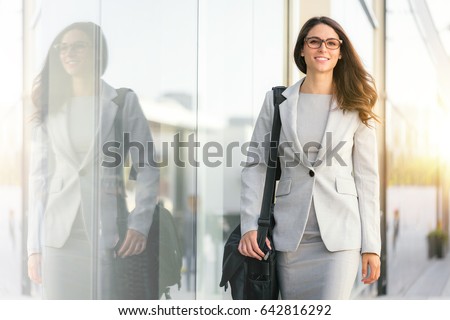 Active lifestyle of mixed ethnicity career business woman walking to work place office Royalty-Free Stock Photo #642816292