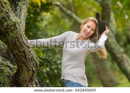 lifestyle outdoor portrait of young beautiful woman on natural background