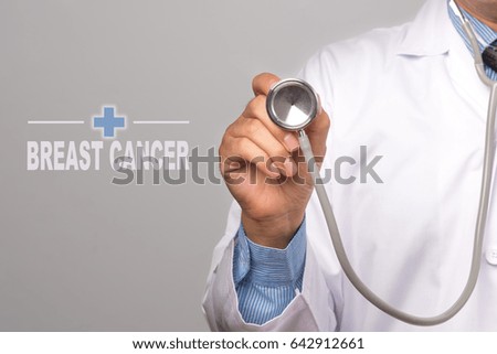 Doctor holding a stethoscope and word "breast cancer"  as medical concept.