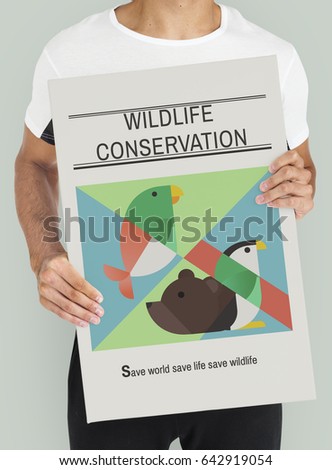 Adult person holding a save the animals banner