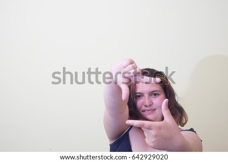 woman making a hand frame