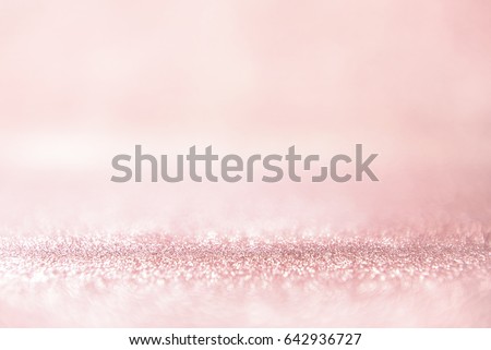 Glitter rose gold lights background. silver and pink. defocused, pastel style.