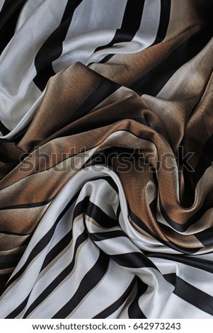Silk dress material cloth texture pattern. 
tailoring stitching concept. Shiny beautiful fashion fabric. Shiny clothing material sample.Creased fabric.