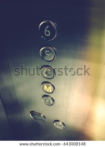 elevator botton indicate m floor by lowtone color