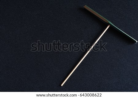 Low key picture of The bamboo-copter, also known as the bamboo dragonfly or Chinese top (Chinese zhuqingting, Japanese taketombo), isolated on black background.