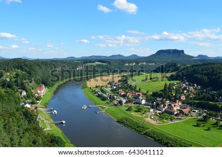 Beautiful view of the Elbe river in summer, Bad Schandau. Saxon Switzerland national park. Protected landscape area of Elbe sandstone. Czech republic, Germany. Royalty-Free Stock Photo #643041112
