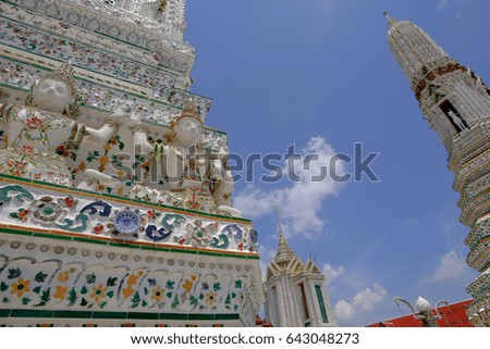 Detail old thai art architecture of main Pagoda at Wat Arun buddhist temple which is a public place, Bangkok Thailand.