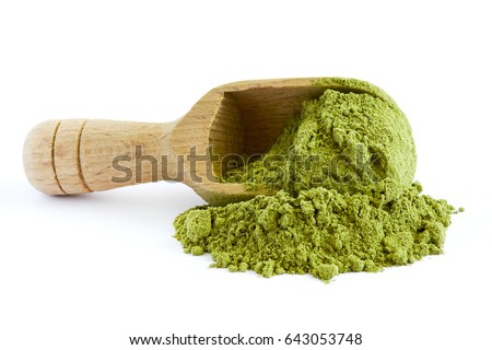 Moringa oleifera powder with wooden scoop isolated on white background Royalty-Free Stock Photo #643053748