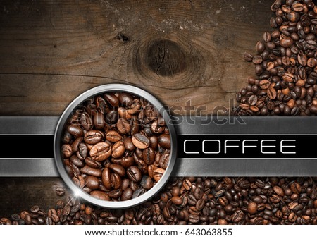 Wood and metal background with roasted coffee beans and text Coffee