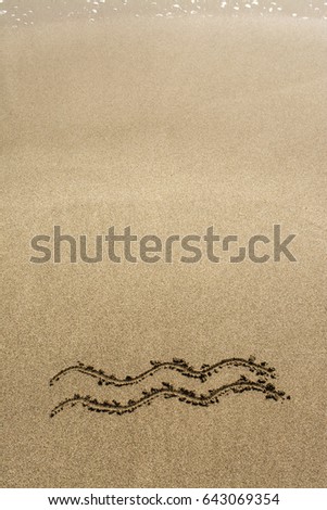 Horoscope signs on sand. 