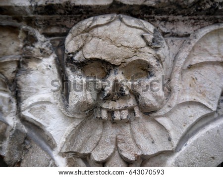 Skull in architecture. Skull with bat wings. Gothic skull architecture